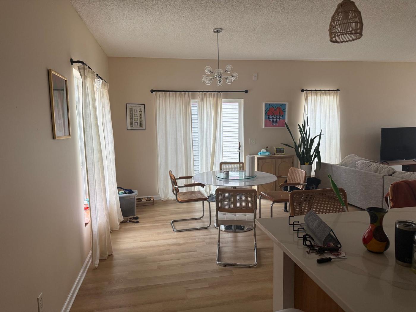 Dining area and kitchen in the same home after painting