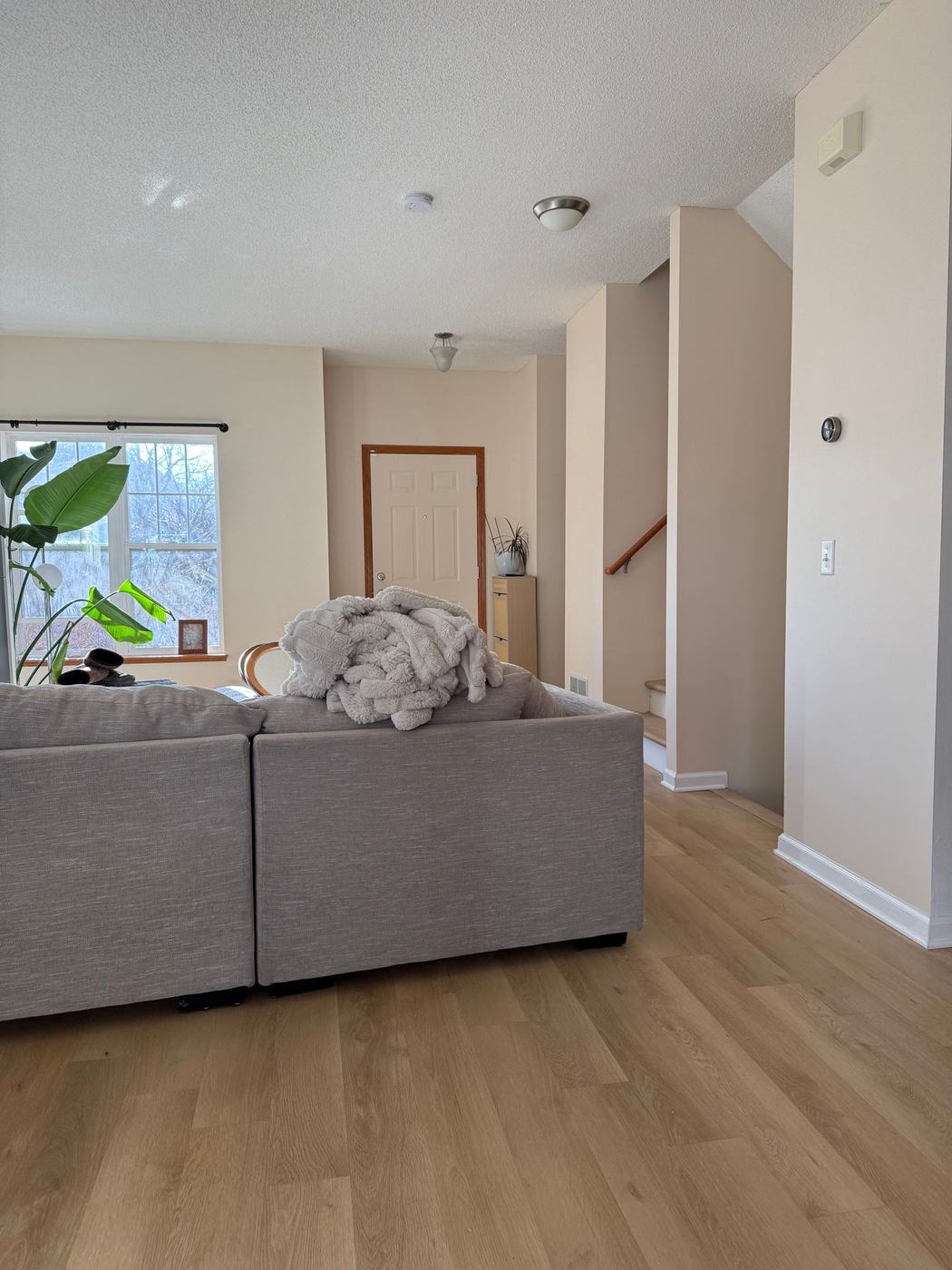 Living room and staircase freshly painted ivory