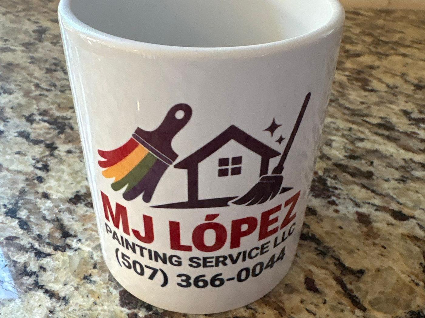 MJ Lopez logo mug left on a granite counter as a thank-you gift